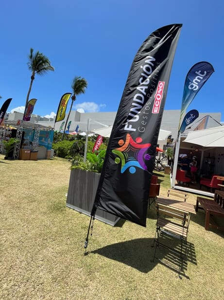 An image of black banner flags with rainbow graphics.